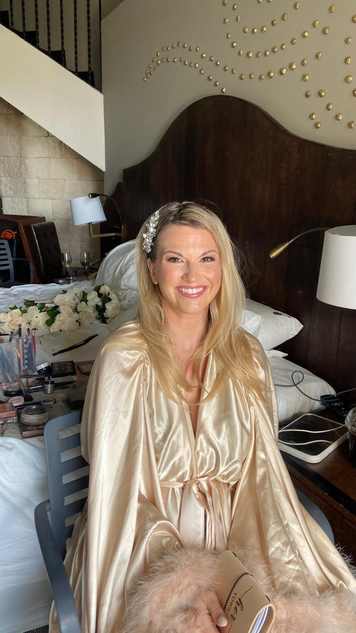 Bride in champagne silk robe with crystal hairpiece